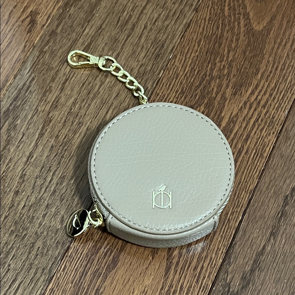 Round Beige Leather Coin Purse with Gold Accents
